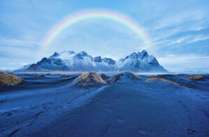 When sunlight enters a raindrop, it is refracted along its path, causing different wavelengths of white light.